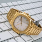 Patek Philippe Nautilus 3800 37MM White Dial With 18K Yellow Gold Bracelet - Image 2